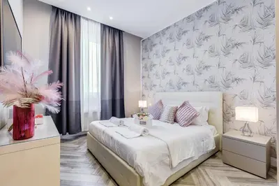 a bedroom with a bed and a large window at Hanky Suite in Rome