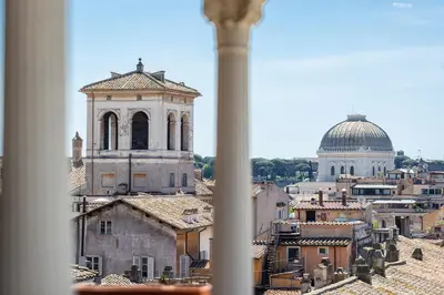 a view of a city from a window at Argentina Penthouse by Rental in Rome in Rome