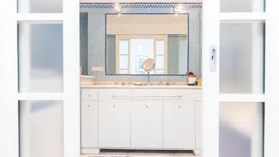 a bathroom with a white sink and a mirror at Rental in Rome Risorgimento view Aparment in Rome