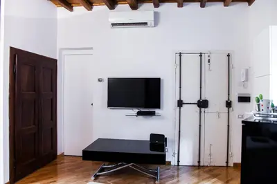 a living room with a flat screen tv on a wall at PgrHome Parione in Rome
