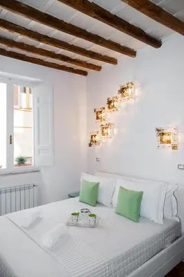a living room with a white couch and a table at PgrHome Parione in Rome