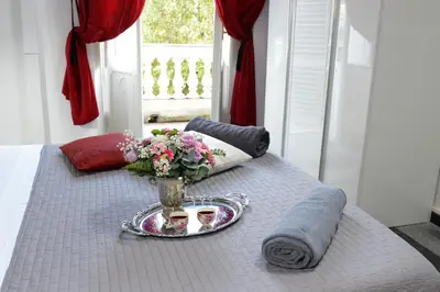 a table with a vase of flowers on top of it at Casa Dania in Rome