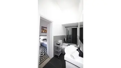 a bathroom with a sink and a mirror at Casa Dania in Rome