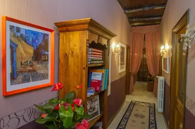 a hallway with a wooden cabinet in a room at Da Augusto in Rome