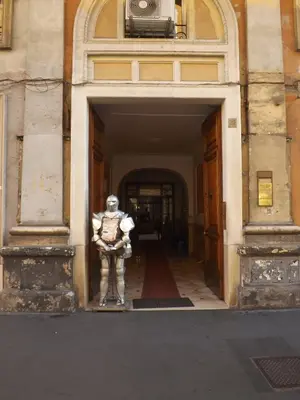 a statue of a man standing in front of a building at Da Augusto in Rome