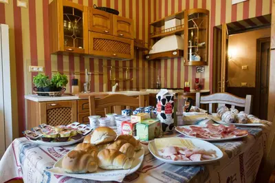 a table with plates of food on it in a kitchen at Da Augusto in Rome