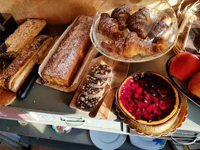 a bunch of different types of bread and pastries at Aurelia Garden Gold B&B in Rome