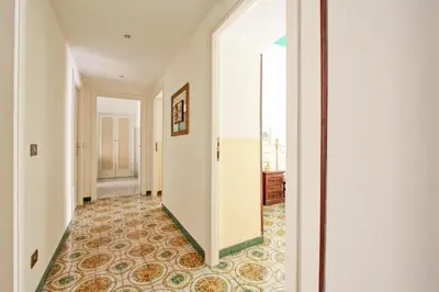an empty hallway with a corridorngthngthngthngthngthngthngth at Roman Apartment in Rome
