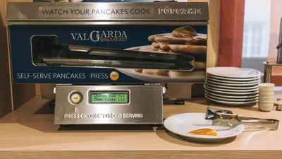 a scale on a counter with a plate of food at Domus Helena in Rome
