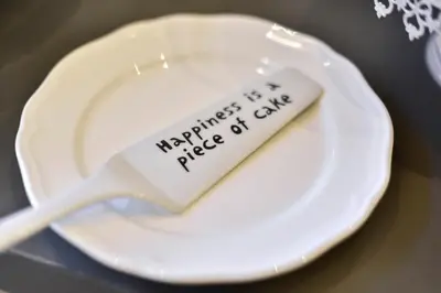 a white spoon with a piece of cake on it at B&B Casa Angelini in Rome