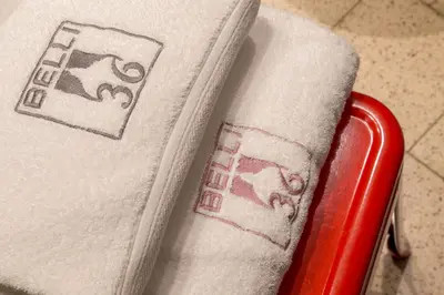 a close up of a towel on a red chair at Belli36rooms near Spanish step and Vatican City in Rome