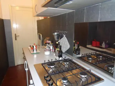 a kitchen with a stove and a counter top at World Wide Bed Piazza del Popolo in Rome