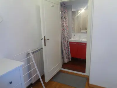 a bathroom with a ladder next to a sink at World Wide Bed Piazza del Popolo in Rome