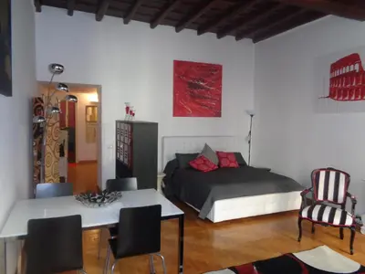 a bedroom with a bed and a table and chairs at World Wide Bed Piazza del Popolo in Rome