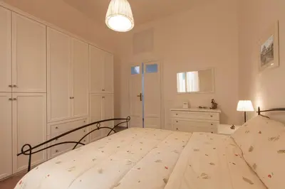 a bedroom with a large bed in a room at MamaR Apartment in Rome