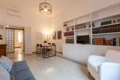 a living room with a couch and a table at MamaR Apartment in Rome