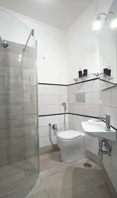 a bathroom with a shower and a toilet and a sink at Viale del Colosseo in Rome