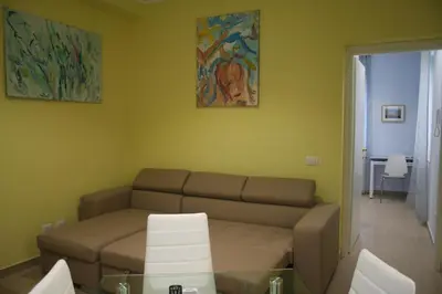 a living room with a couch and a table at Sweet Monte Verde in Rome