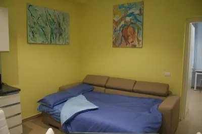 a bedroom with a bed with two pillows on it at Sweet Monte Verde in Rome