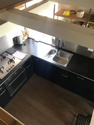a kitchen with a sink and a stove at Over The Tiber Loft in Rome