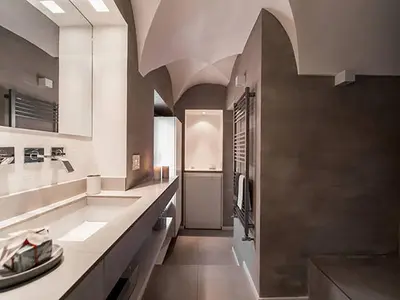 a large bathroom with a large sink and a counter at Over The Tiber Loft in Rome