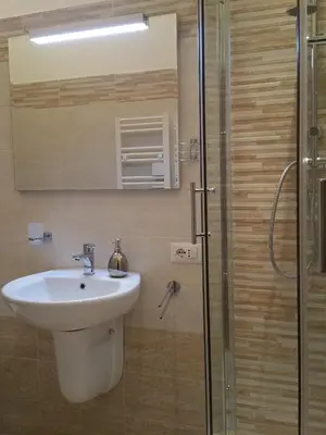 a bathroom with a sink and a shower at Mondo Antico in Rome