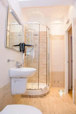 a bathroom with a shower and a toilet and a sink at Mondo Antico in Rome