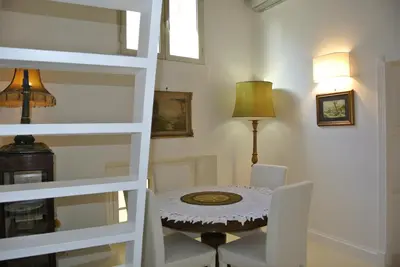 a dining room with a table and chairs at Pantheon Domus Valentino in Rome