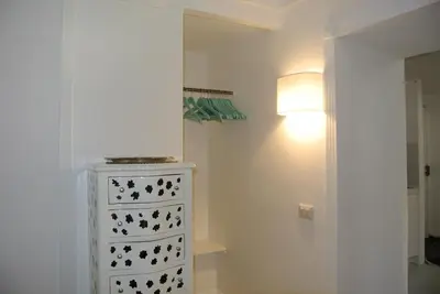 a room with a white dresser and a lamp at Pantheon Domus Valentino in Rome