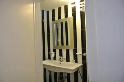 a bathroom with a sink and a mirror at Pantheon Domus Valentino in Rome