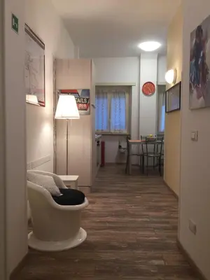 a hallway with a toilet in the middle of a room at Maison Velia in Rome