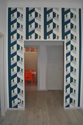 a room with a wall covered in wine bottles at Granny's House Colosseum in Rome
