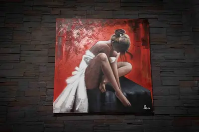 a painting of a woman sitting on a wall at Audrey Rooms in Rome