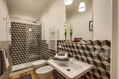 a bathroom with a sink and a toilet and a shower at The Club Navona in Rome