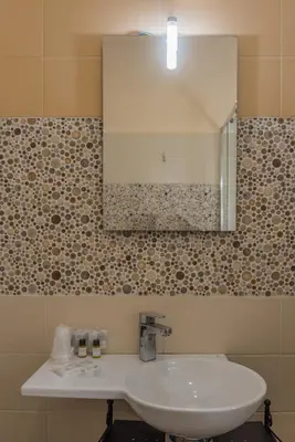 a bathroom with a white sink and a mirror at Hotel Bella Vita in Rome