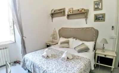 a bedroom with a bed with two pillows on it at B&B Next Stop in Rome