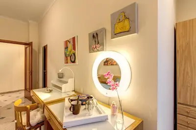 a bathroom with a sink and a mirror at Residenza Amoroma in Rome