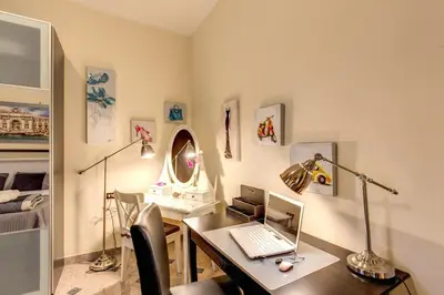 a room with a desk with a laptop computer on it at Residenza Amoroma in Rome