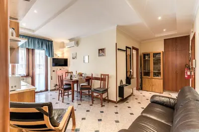 a living room with a couch and a table at Residenza Amoroma in Rome