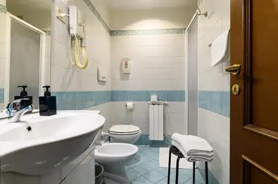 a bathroom with a sink and a toilet at Domus Julia Trevi - Spagna in Rome