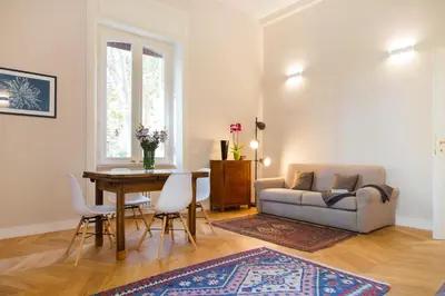 a living room with a table and a couch at Casa Tommasina in Rome