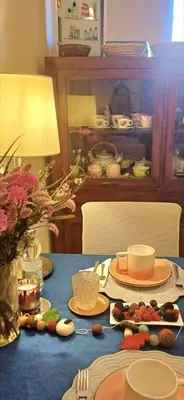 a blue table with plates of food on it at Dante in Rome