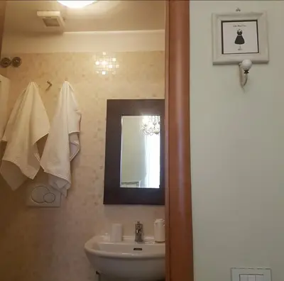 a bathroom with a sink and a mirror at Dante in Rome