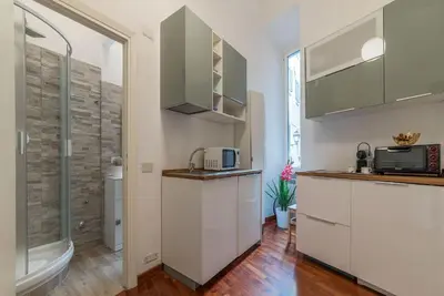 a kitchen with a sink and a microwave at CS Piazza Venezia Apartment in Rome