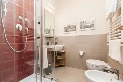 a bathroom with a shower and a toilet and a sink at Lovely House Rome in Rome