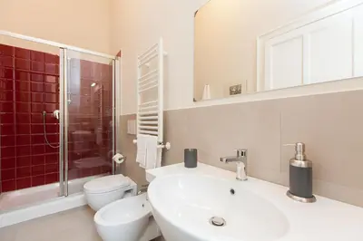 a bathroom with a sink and a toilet and a shower at Lovely House Rome in Rome