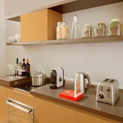a kitchen with a counter top with a stove top oven at Palazzo Scanderbeg in Rome