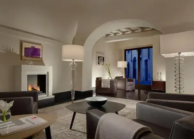 a living room with furniture and a fireplace at Palazzo Scanderbeg in Rome