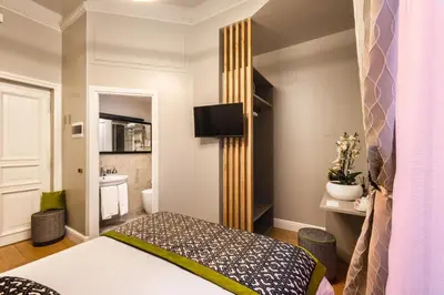 a bedroom with a bed and a bathroom at MyBedCavour in Rome