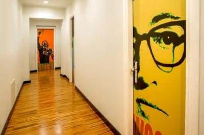 a hallway with a door with a painting on the wall at Suitedreams in Rome
